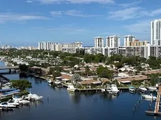 a kitchen with kitchen island granite countertop a sink and a stove