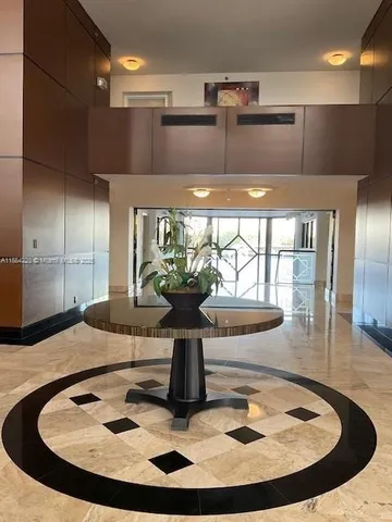 a view of staircase with a view of living room
