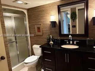 a living room with furniture and painting on the wall