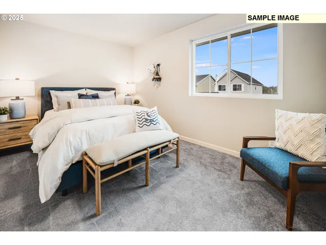 a bedroom with a bed and a couch