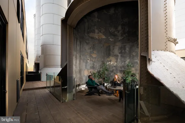 a view of hallway with livingroom and furniture