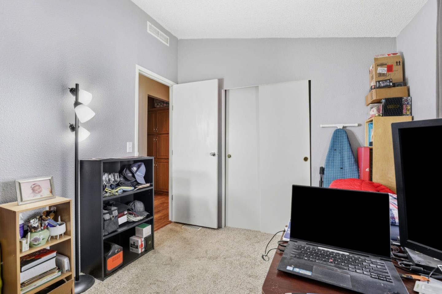 20 Russell Road, Unit 8 Salinas, CA 93906 - Photo 14 of 38 a room with bookshelf and a window