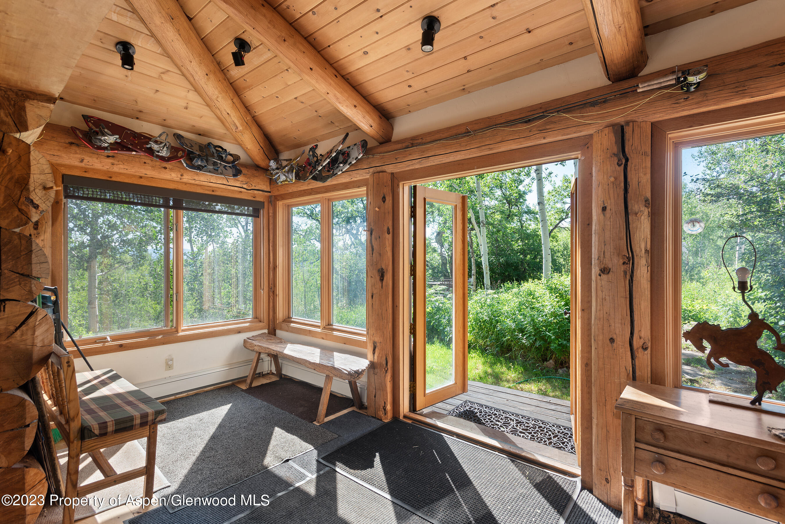 4275 Sopris Mountain Ranch Road Basalt, CO 81621 - Photo 12 of 36 a living room with large windows