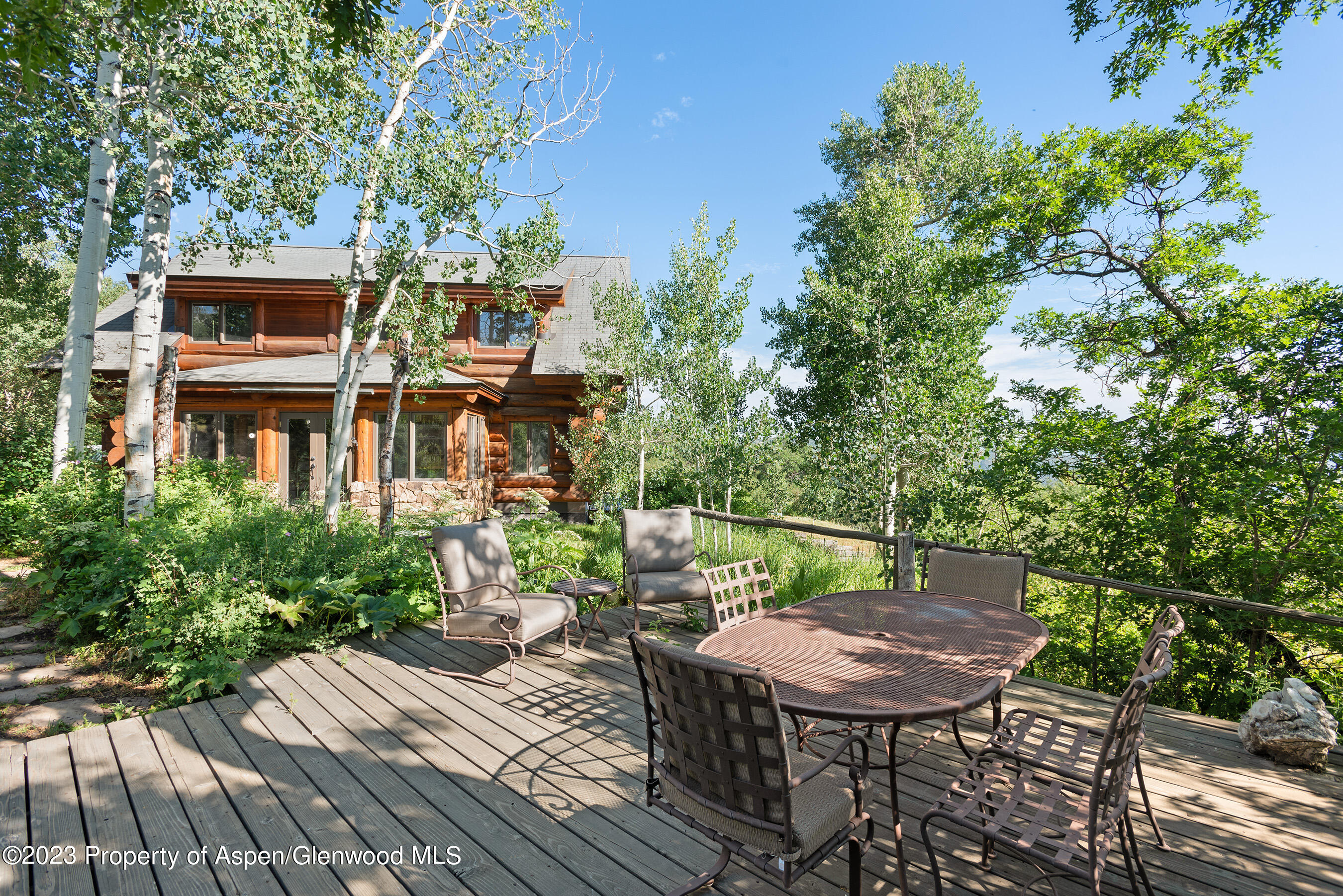 4275 Sopris Mountain Ranch Road Basalt, CO 81621 - Photo 21 of 36 a balcony with wooden floor table and chairs