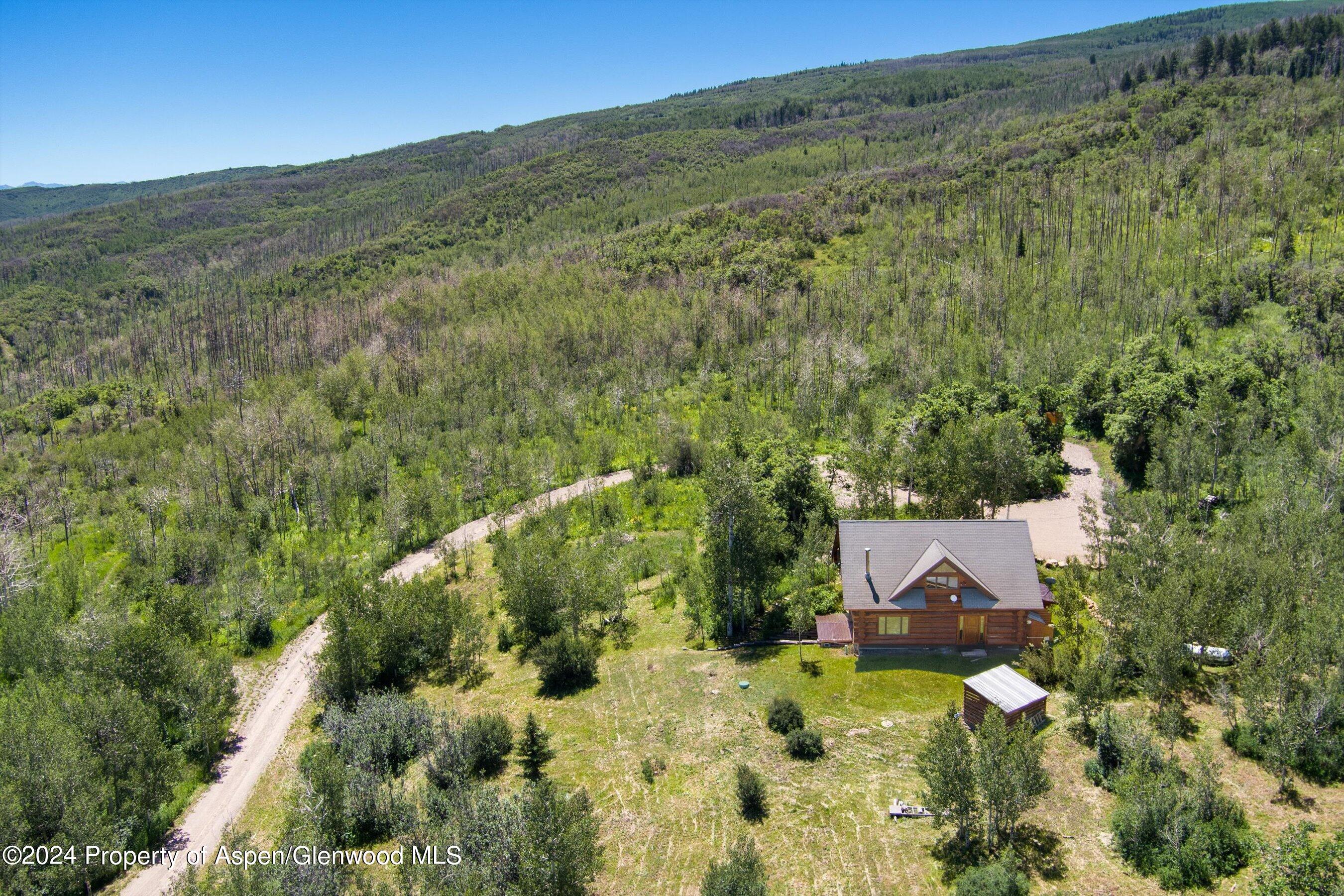4275 Sopris Mountain Ranch Road Basalt, CO 81621 - Photo 25 of 36 a view of a house with a mountain