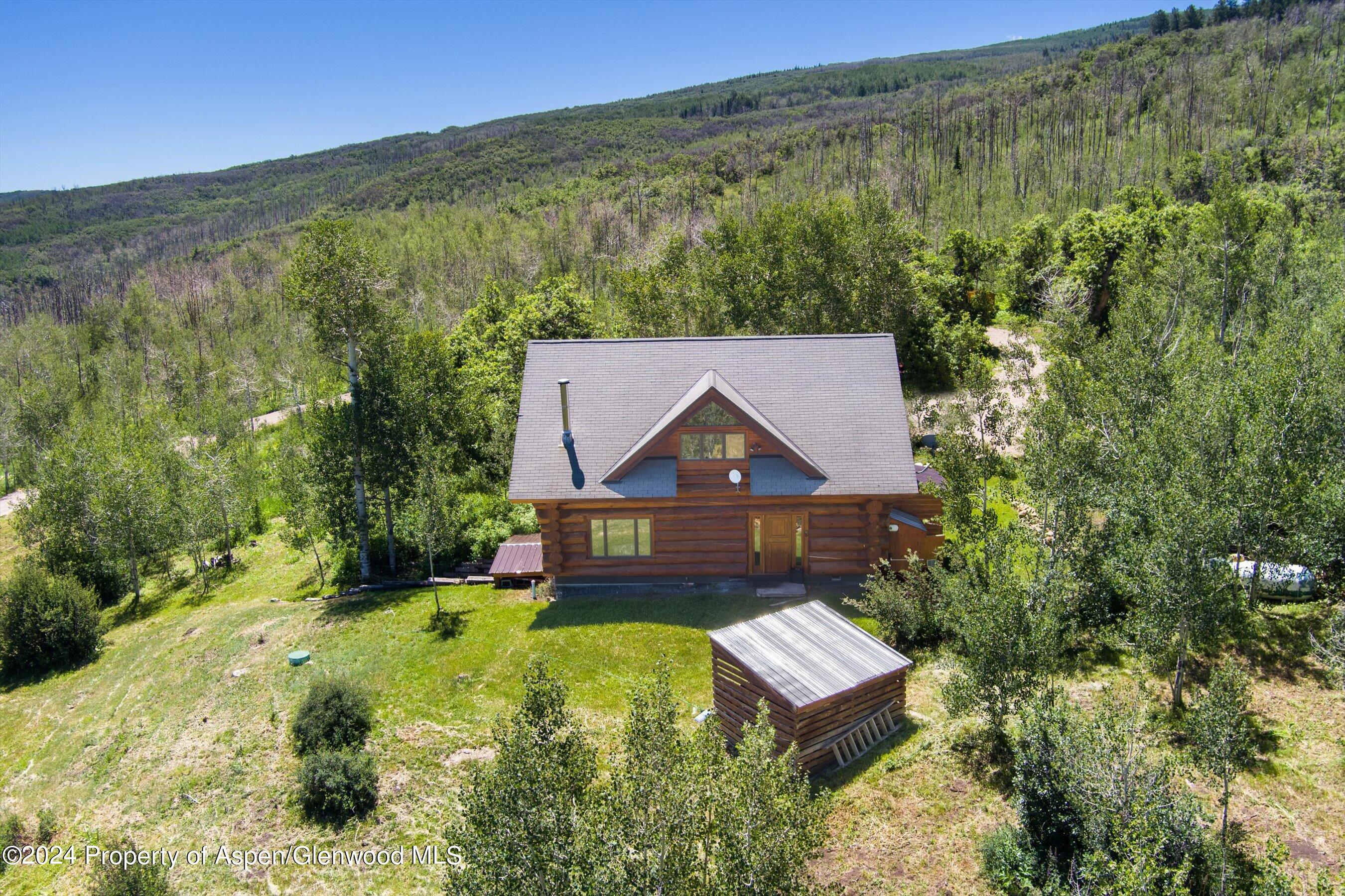 4275 Sopris Mountain Ranch Road Basalt, CO 81621 - Photo 28 of 36 a aerial view of a house with a yard