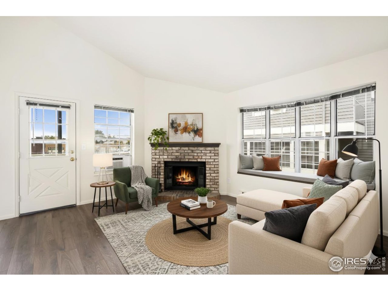 2828 Silverplume Drive, Unit R3 Fort Collins, CO 80526 - Photo 4 of 45 a living room with furniture a fireplace and a large window