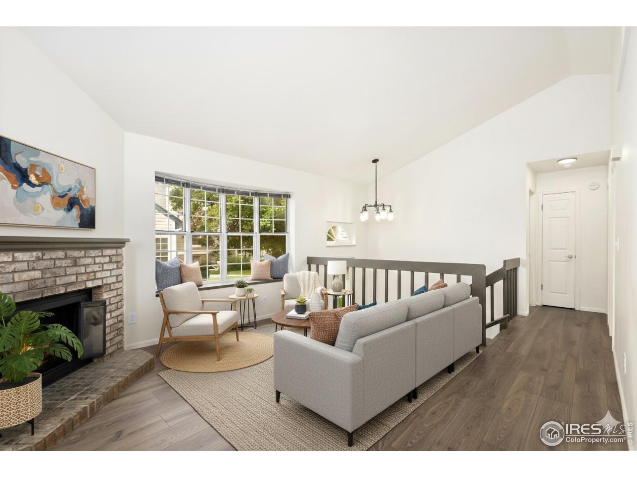 2828 Silverplume Drive, Unit R3 Fort Collins, CO 80526 - Photo 5 of 45 a living room with furniture a fireplace and a large window