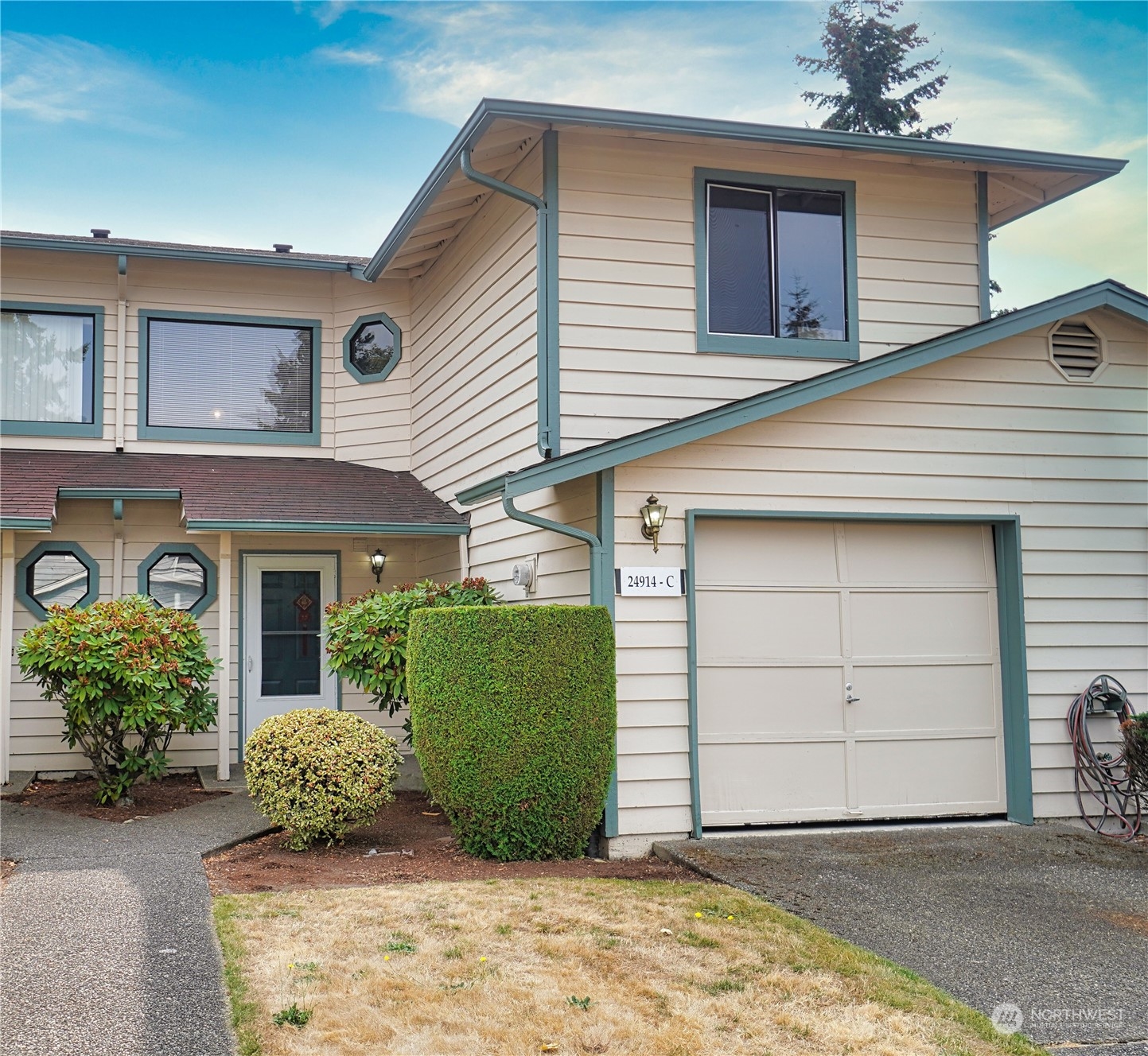 24914 109th Place Southeast, Unit 34C Kent, WA 98030 - Photo 1 of 38 a front view of a house