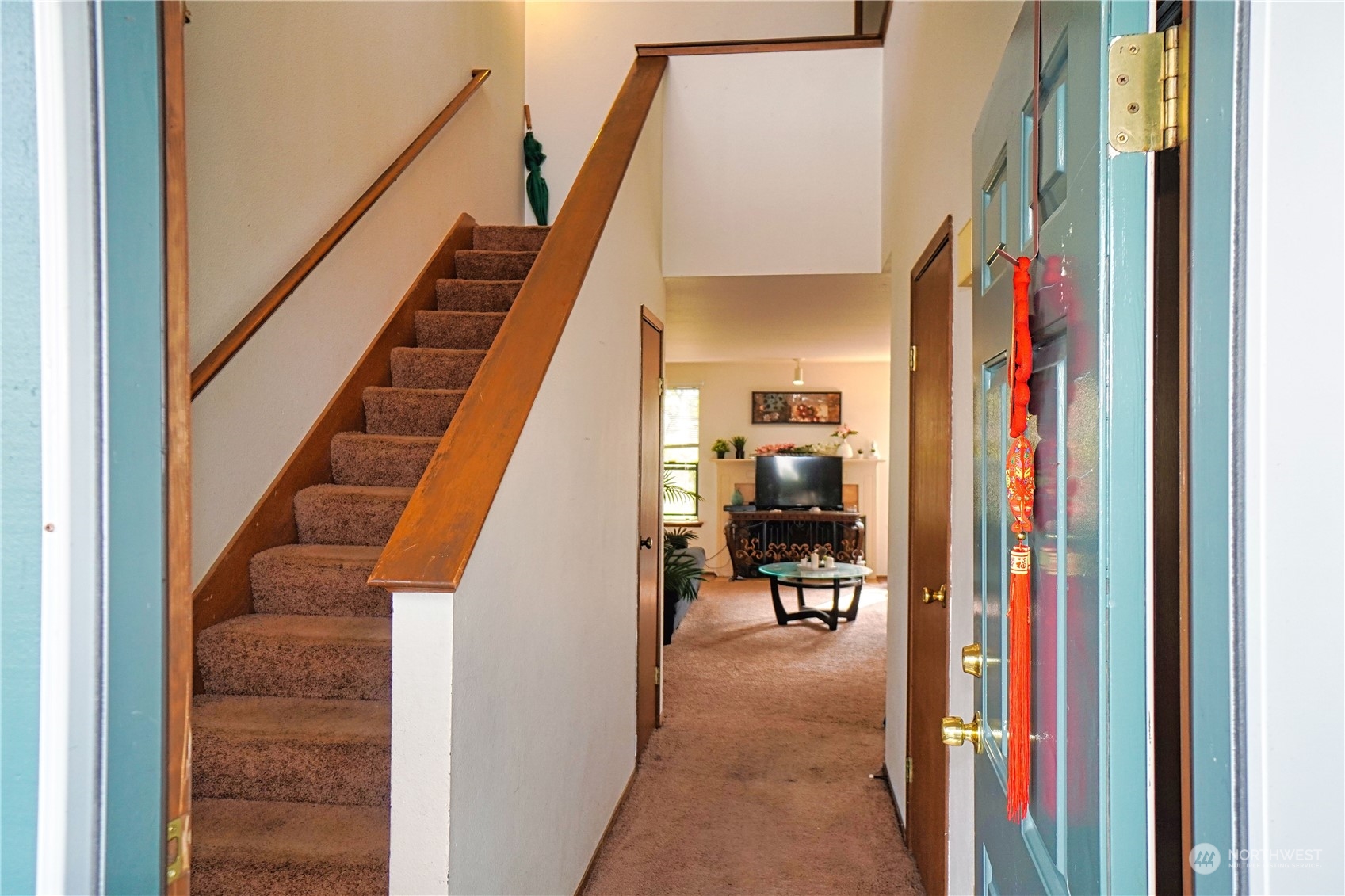 24914 109th Place Southeast, Unit 34C Kent, WA 98030 - Photo 28 of 38 a view of a hallway with living room and furniture
