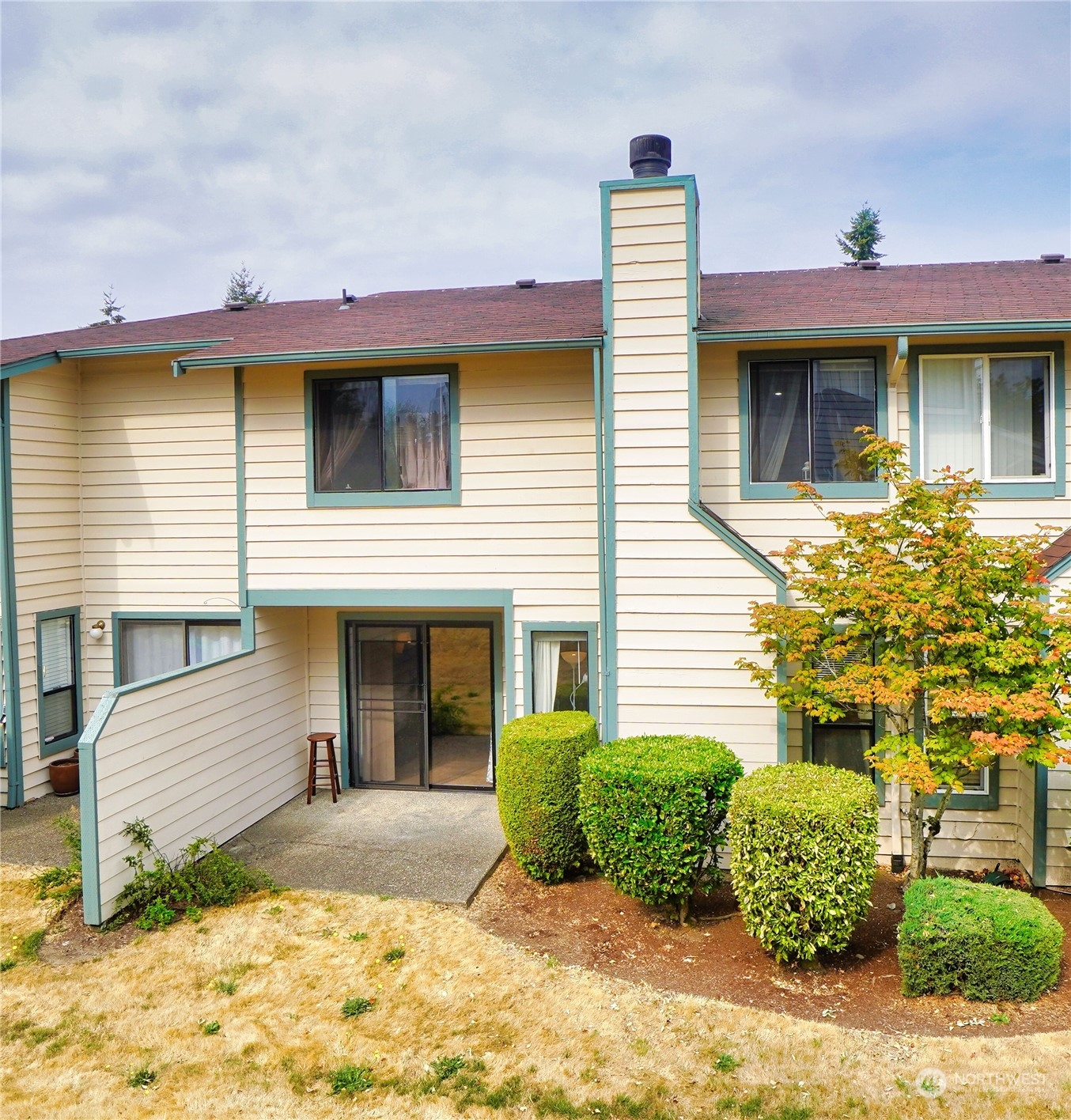 24914 109th Place Southeast, Unit 34C Kent, WA 98030 - Photo 29 of 38 a front view of a house with a yard