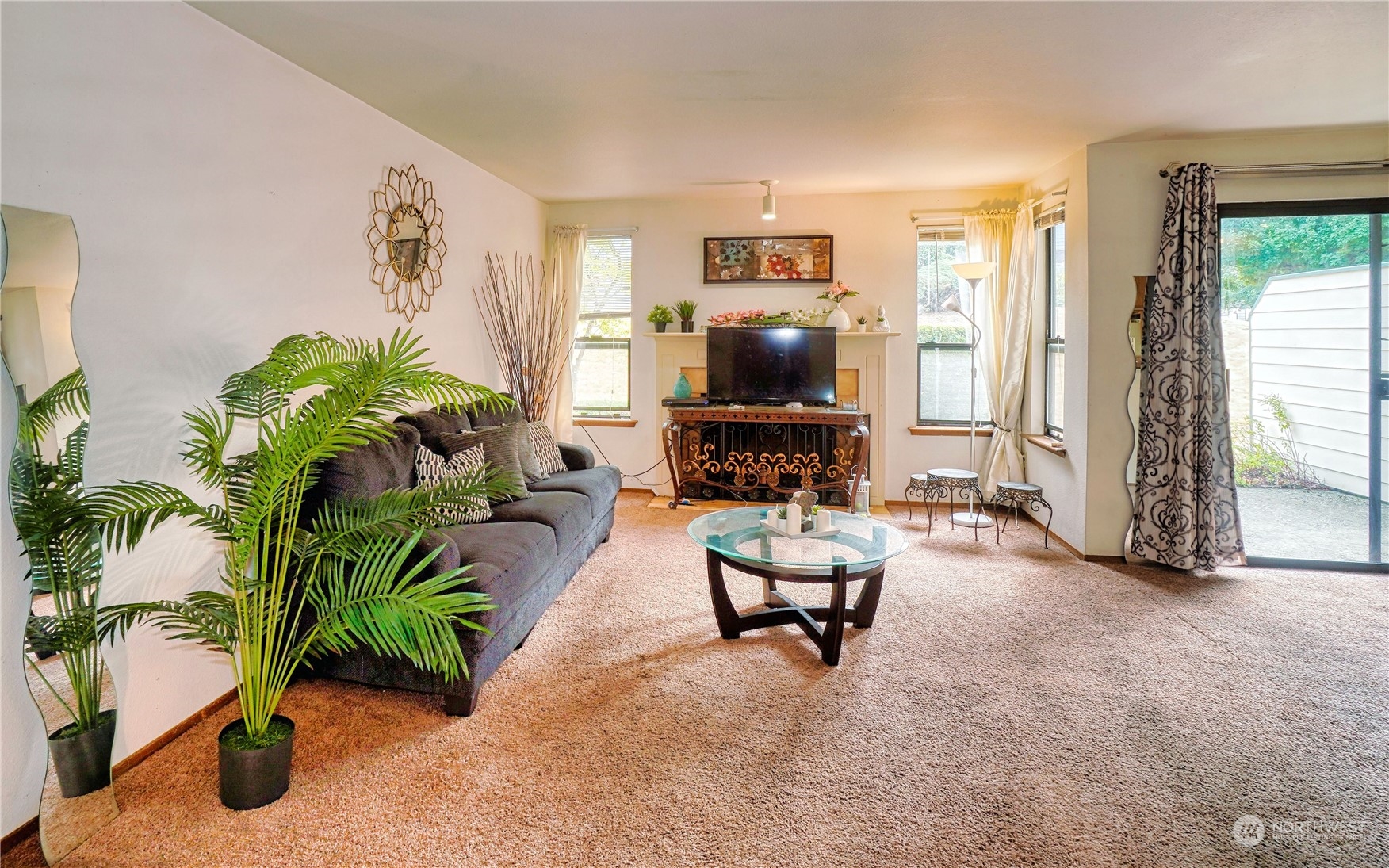 24914 109th Place Southeast, Unit 34C Kent, WA 98030 - Photo 5 of 38 a living room with furniture and a flat screen tv