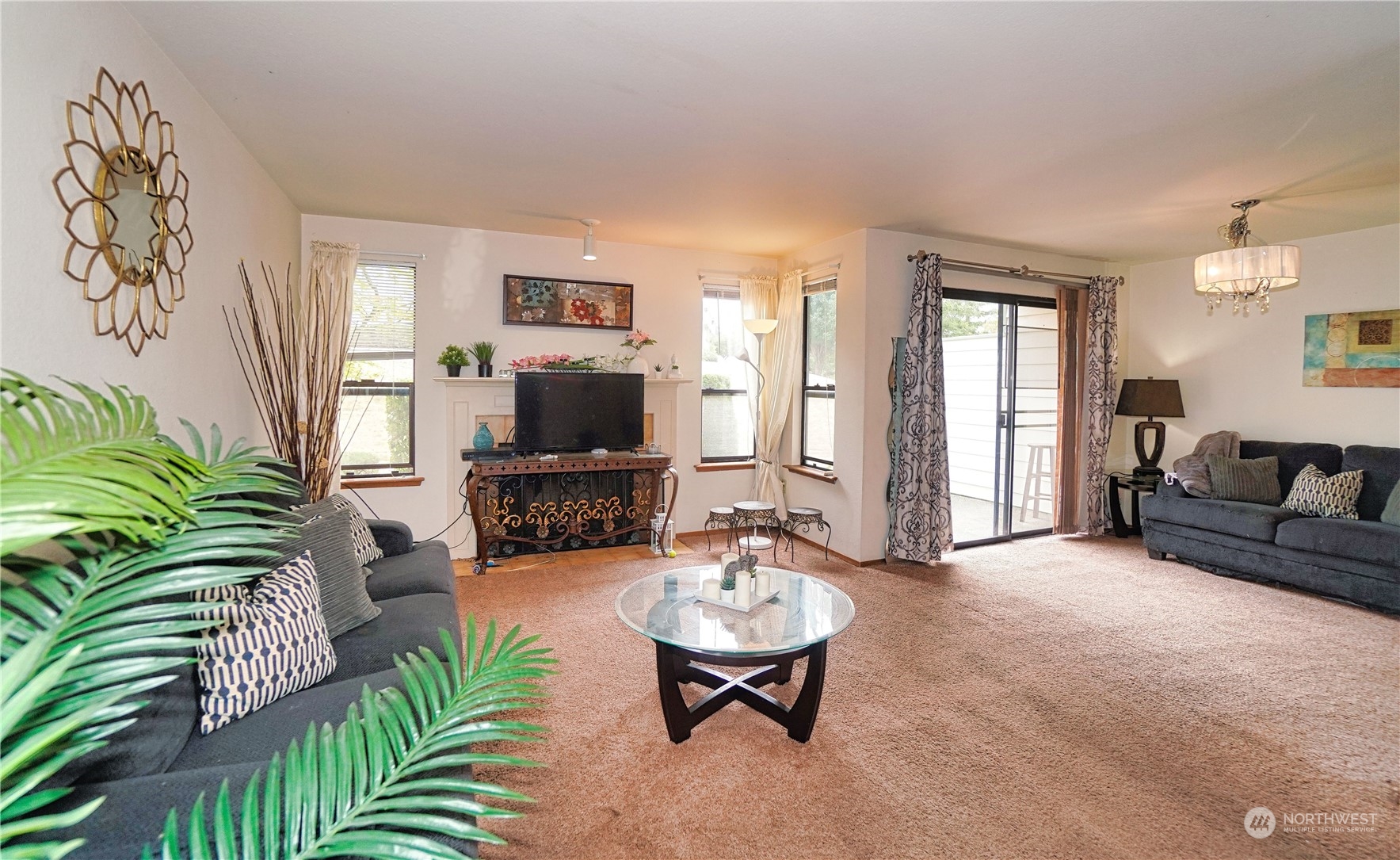 24914 109th Place Southeast, Unit 34C Kent, WA 98030 - Photo 6 of 38 a living room with furniture and a flat screen tv