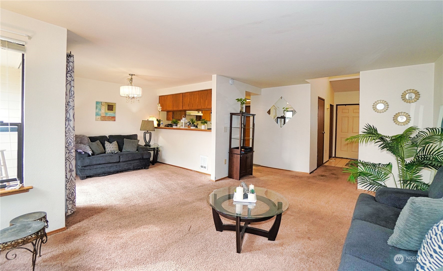 24914 109th Place Southeast, Unit 34C Kent, WA 98030 - Photo 7 of 38 a living room with furniture and a wooden floor