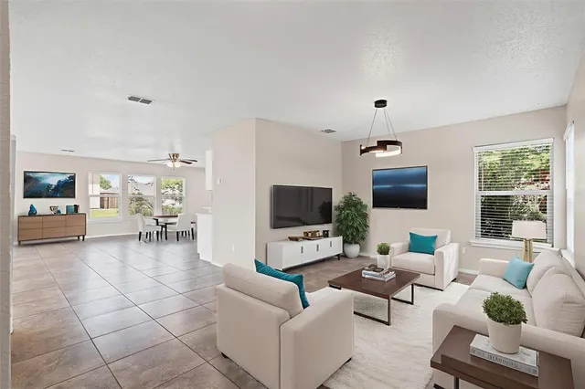 a living room with furniture and a flat screen tv