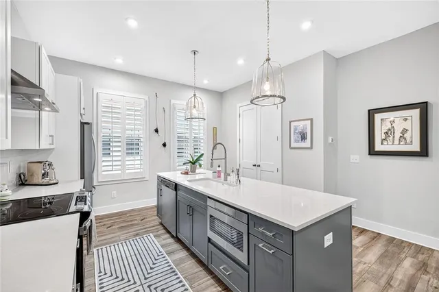 a view of the house with roof and sitting area