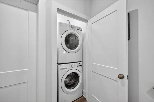 a bedroom with a bed a chair and a window