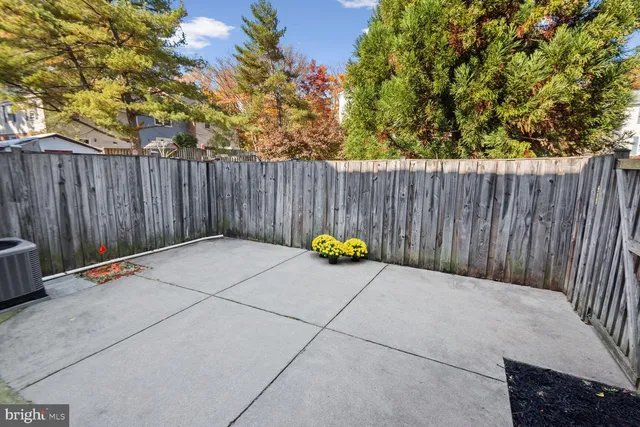 a view of outdoor space with wooden fence