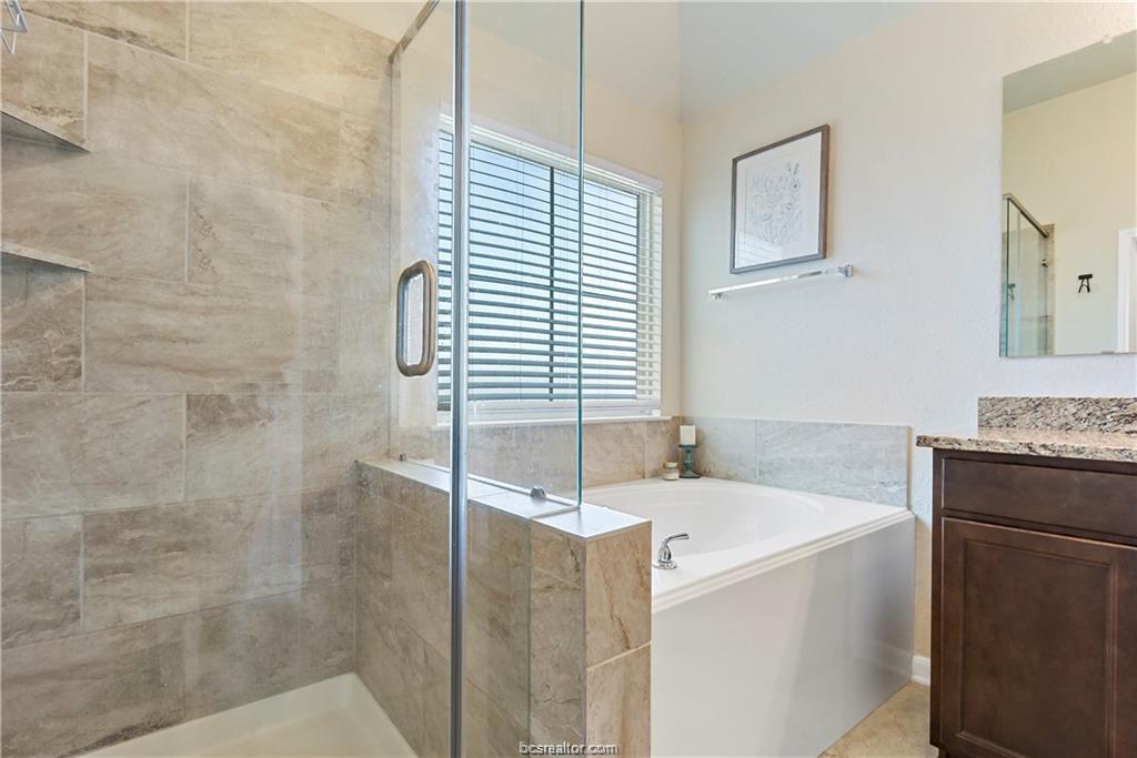 2000 Bleeker Cove Bryan, TX 77807 - Photo 18 of 24 a bathroom with a sink and a bathtub
