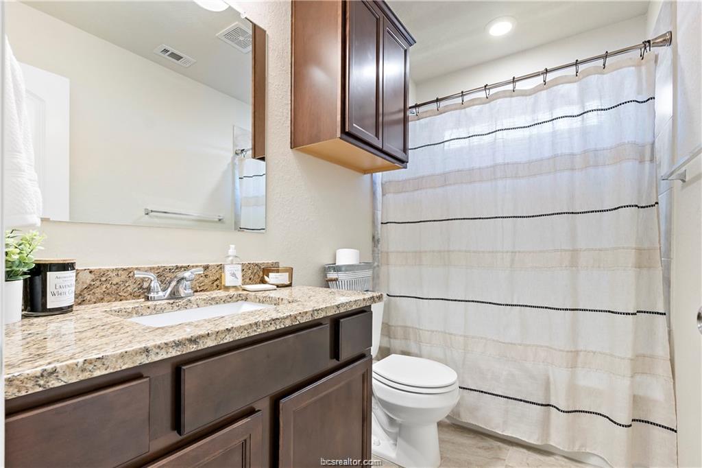 2000 Bleeker Cove Bryan, TX 77807 - Photo 20 of 24 a bathroom with a sink and a mirror
