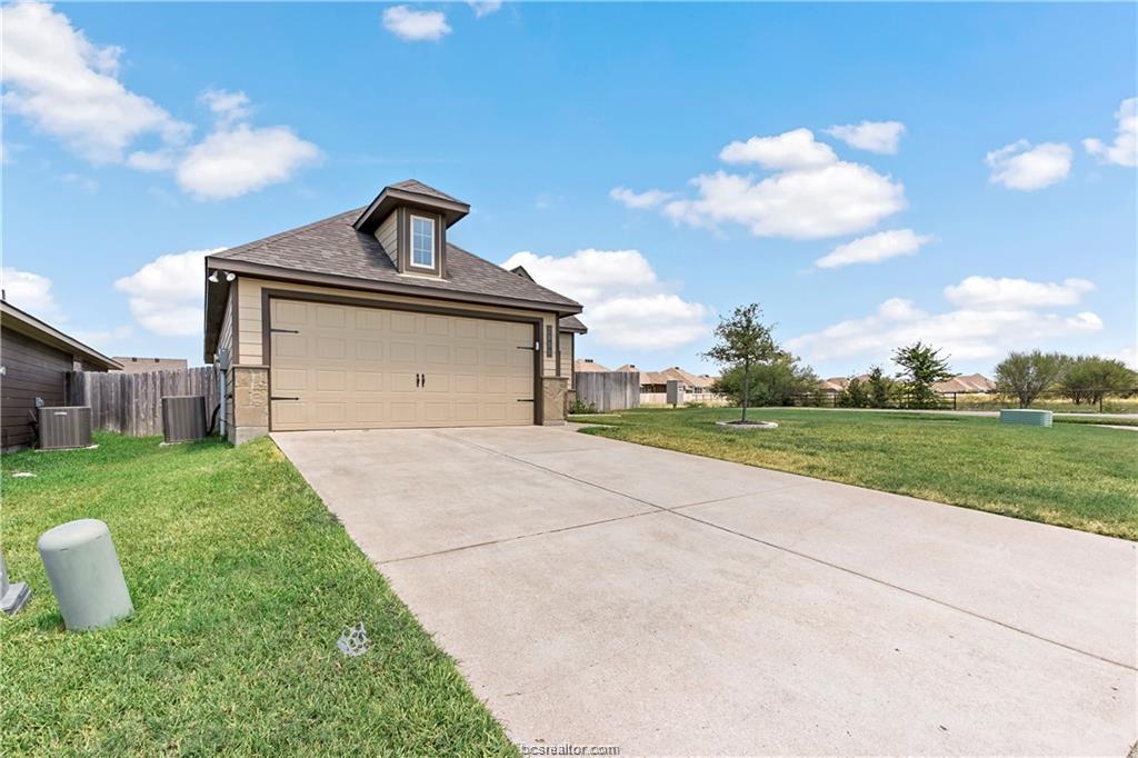 2000 Bleeker Cove Bryan, TX 77807 - Photo 2 of 24 a front view of a house with garden