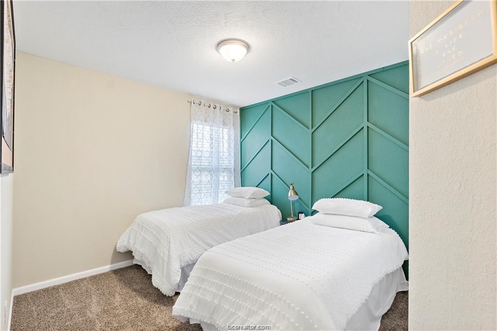 2000 Bleeker Cove Bryan, TX 77807 - Photo 21 of 24 a bedroom with two beds and a window