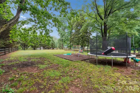a view of a park with large trees