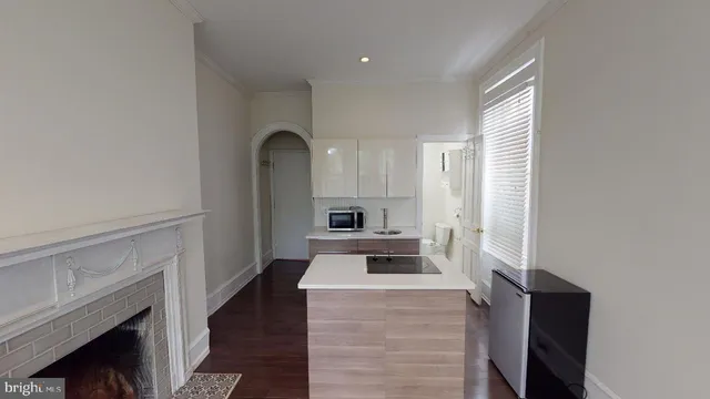 a kitchen with granite countertop a stove and a refrigerator