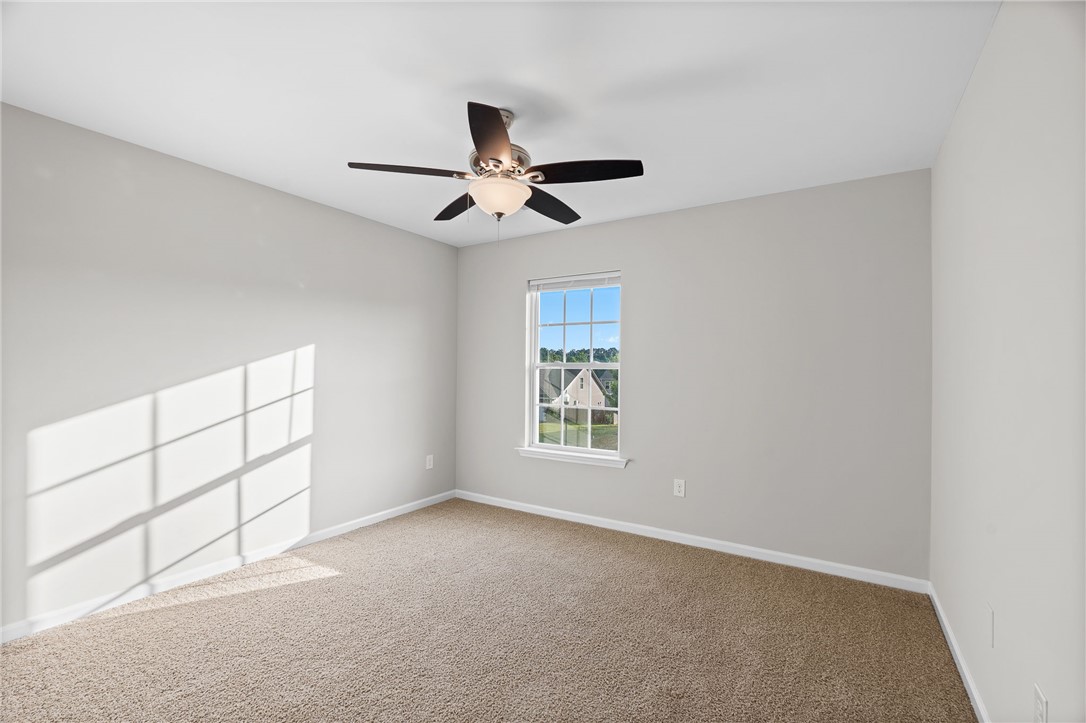 119 Sunny Point Loop Central, SC 29630 - Photo 26 of 33 Natural light streams across soft carpeted flooring in this comfortable bedroom.