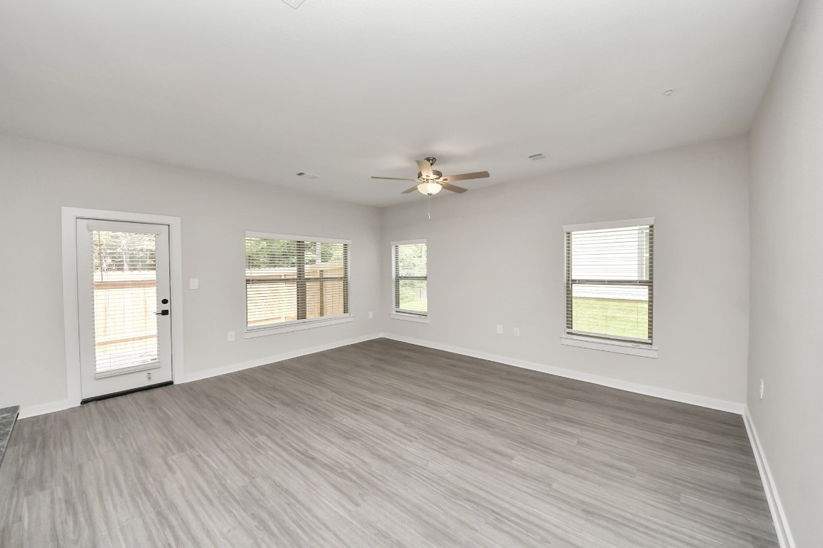 7711 Longmire Road, Unit 155 Conroe, TX 77304 - Photo 45 of 48 Boasting luxury finishes-stylish Island kitchen,granite counters,subway tile backsplash,ample custom cabinet space,stainless appliances,refrigerator,full size washer&dryer included,wood-like floors throughout,open concept floor plan.