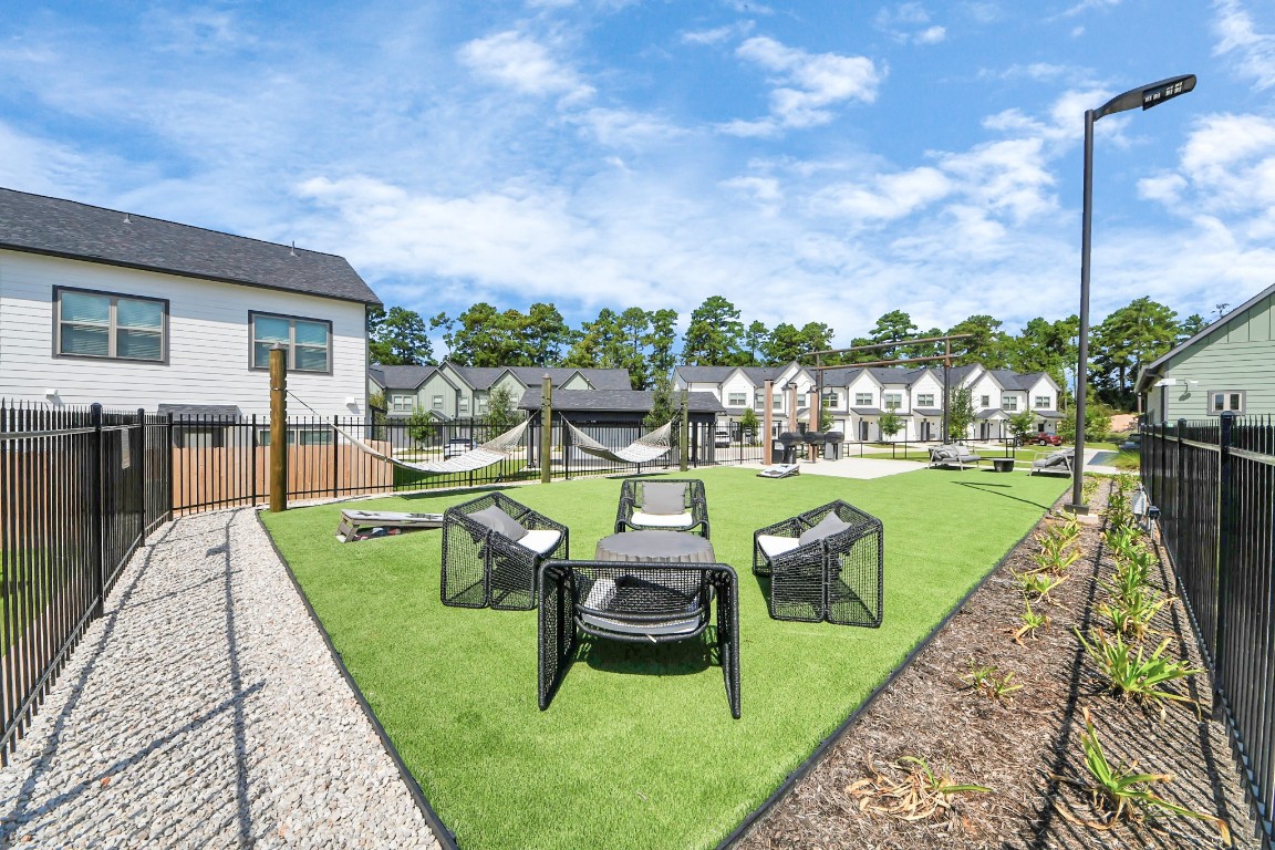 7711 Longmire Road, Unit 155 Conroe, TX 77304 - Photo 27 of 48 Enjoy an abundance of Amenities:Resort-Style Pool w/Sundeck Ledge&Outdoor Lounge Areas w/Grilling area,Gaming Lawn,Pickleball Court,Quaint Dog Park for your fur babies!24/7 Fitness Center w/Kids Play Zone area.Stunning Clubhouse w/Café/Lounge.Playground Area.Electric Vehicle Charging Stations!