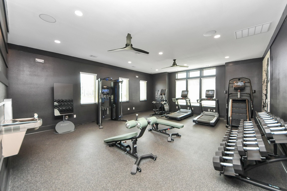 7711 Longmire Road, Unit 155 Conroe, TX 77304 - Photo 31 of 48 Enjoy an abundance of Amenities:Resort-Style Pool w/Sundeck Ledge&Outdoor Lounge Areas w/Grilling area,Gaming Lawn,Pickleball Court,Quaint Dog Park for your fur babies!24/7 Fitness Center w/Kids Play Zone area.Stunning Clubhouse w/Café/Lounge.Playground Area.Electric Vehicle Charging Stations!