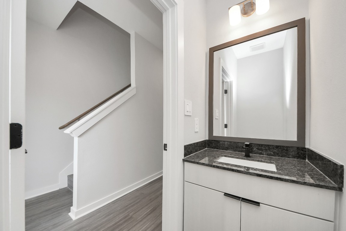 7711 Longmire Road, Unit 155 Conroe, TX 77304 - Photo 6 of 48 Half Bathroom with granite vanity.