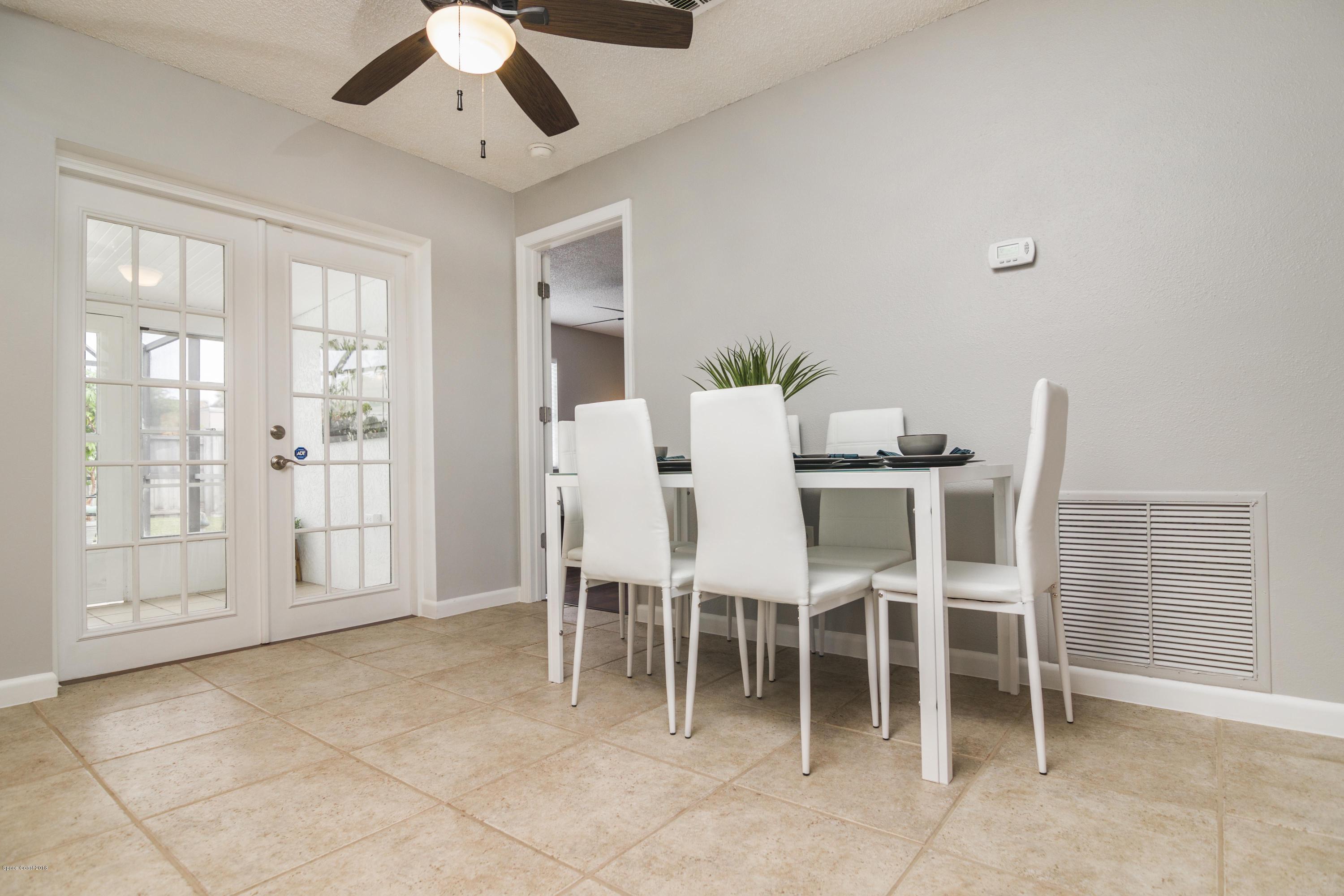 2227 Spring Circle Cocoa, FL 32926 - Photo 5 of 25 Dining Area to Florida Room