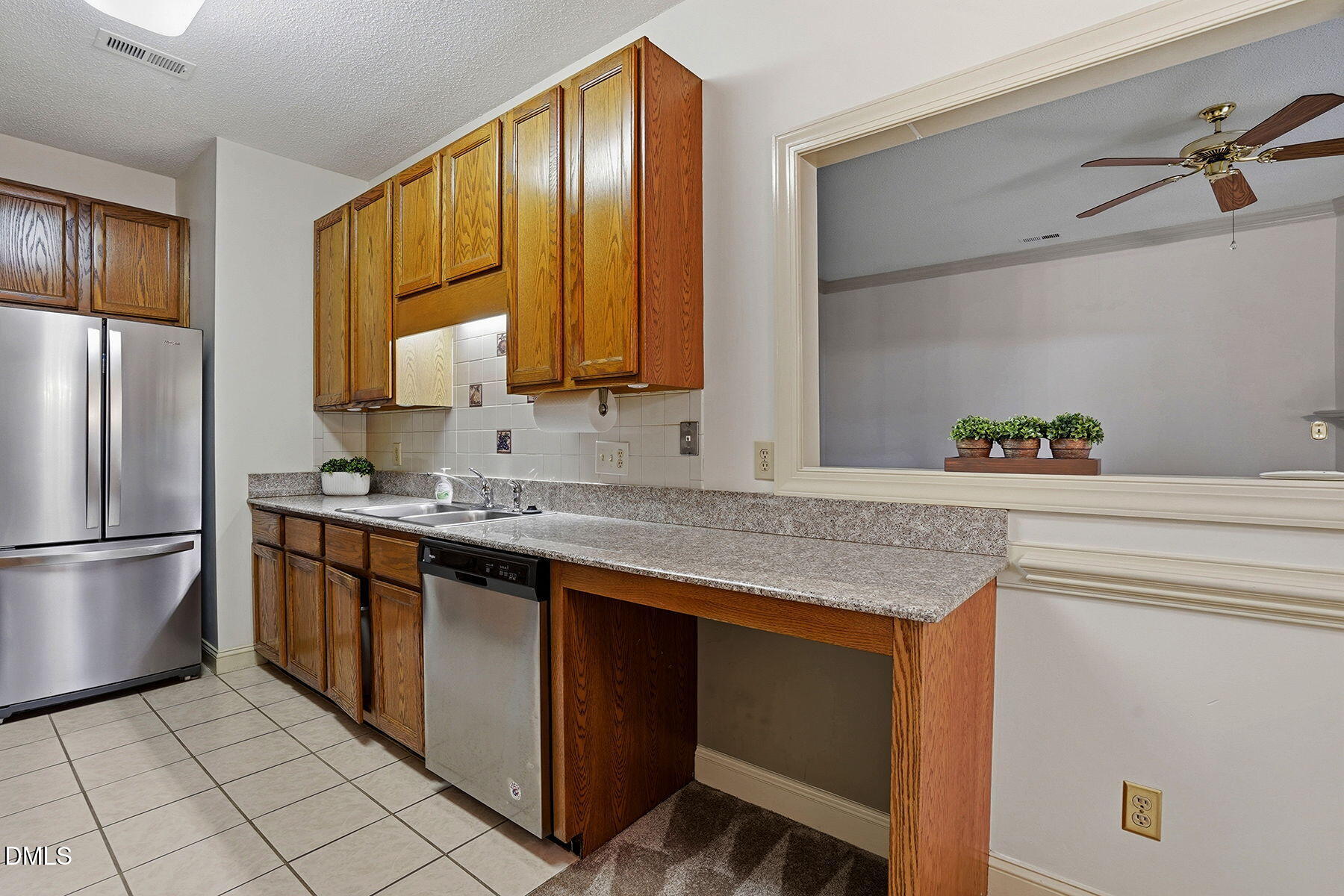 1210 Shadow Bark Court Raleigh, NC 27603 - Photo 17 of 29 a kitchen with stainless steel appliances granite countertop a sink stove and refrigerator
