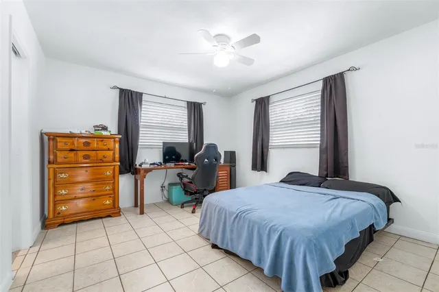 a bedroom with a bed and dresser