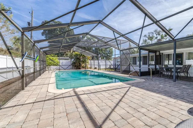 an aerial view of multiple houses with yard