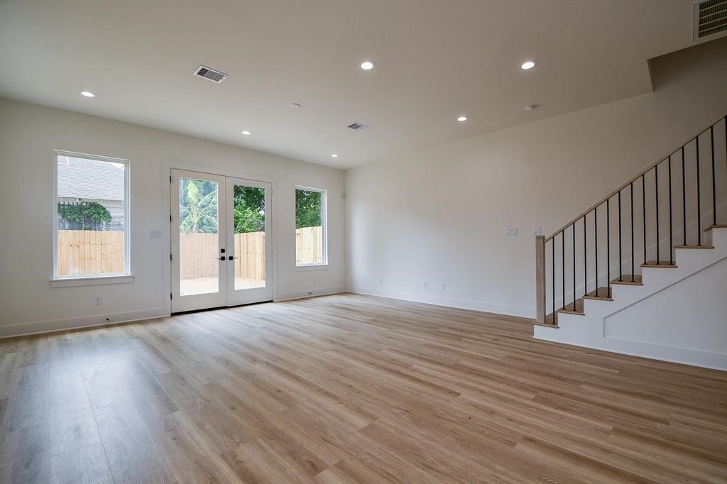2305 Maury Street Houston, TX 77026 - Photo 7 of 19 Entertain your guests effortlessly in the oversized living room, pre wired for speakers, while enjoying the scenic view of the large backyard through elegant glass French doors.