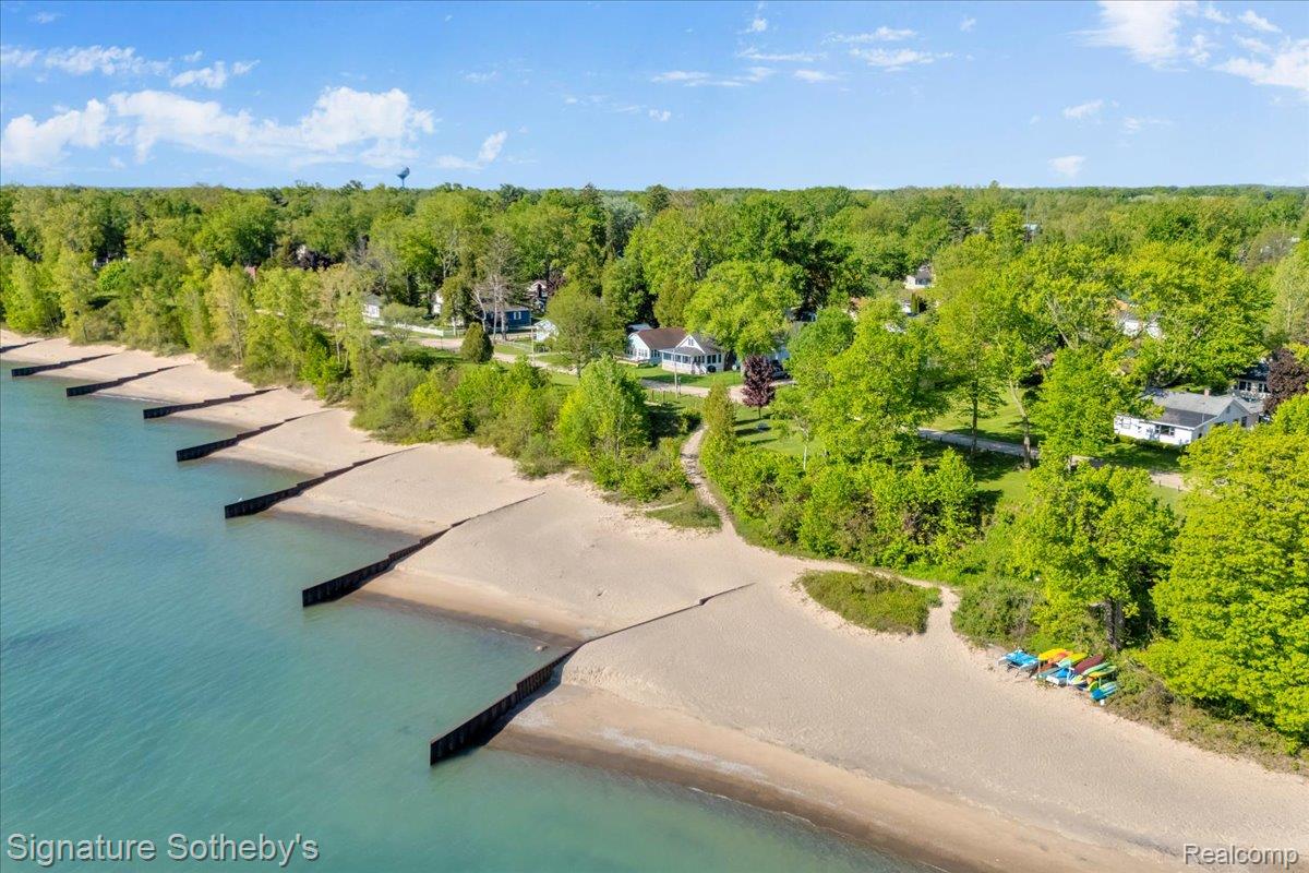 6997 Lakeshore Road Lexington, MI 48450 - Photo 4 of 55 Expansive sandy shoreline featuring multiple breakwaters