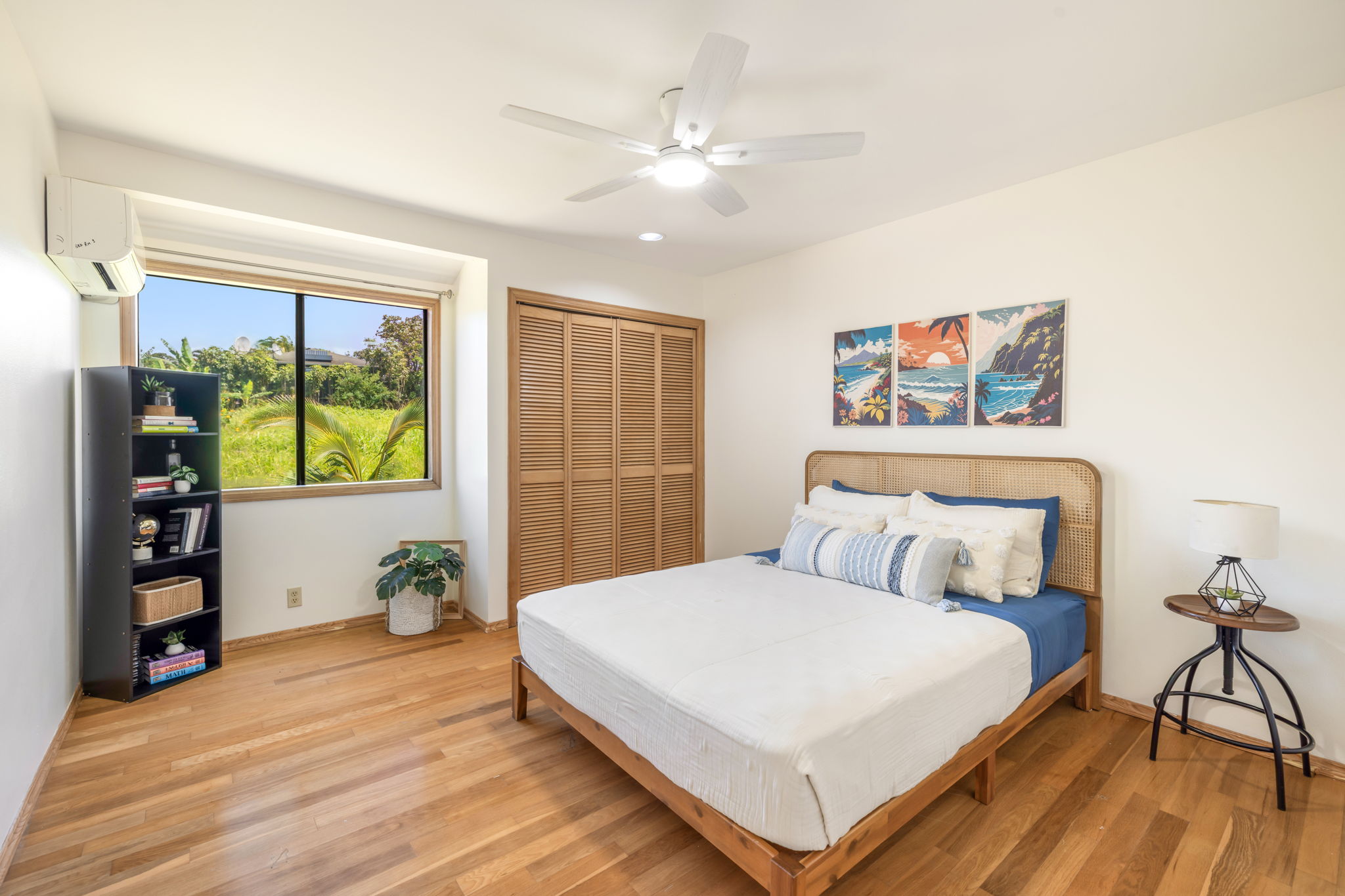 3685 Waha Road Kalaheo, HI 96741 - Photo 14 of 30 a bedroom with a large bed and a chandelier