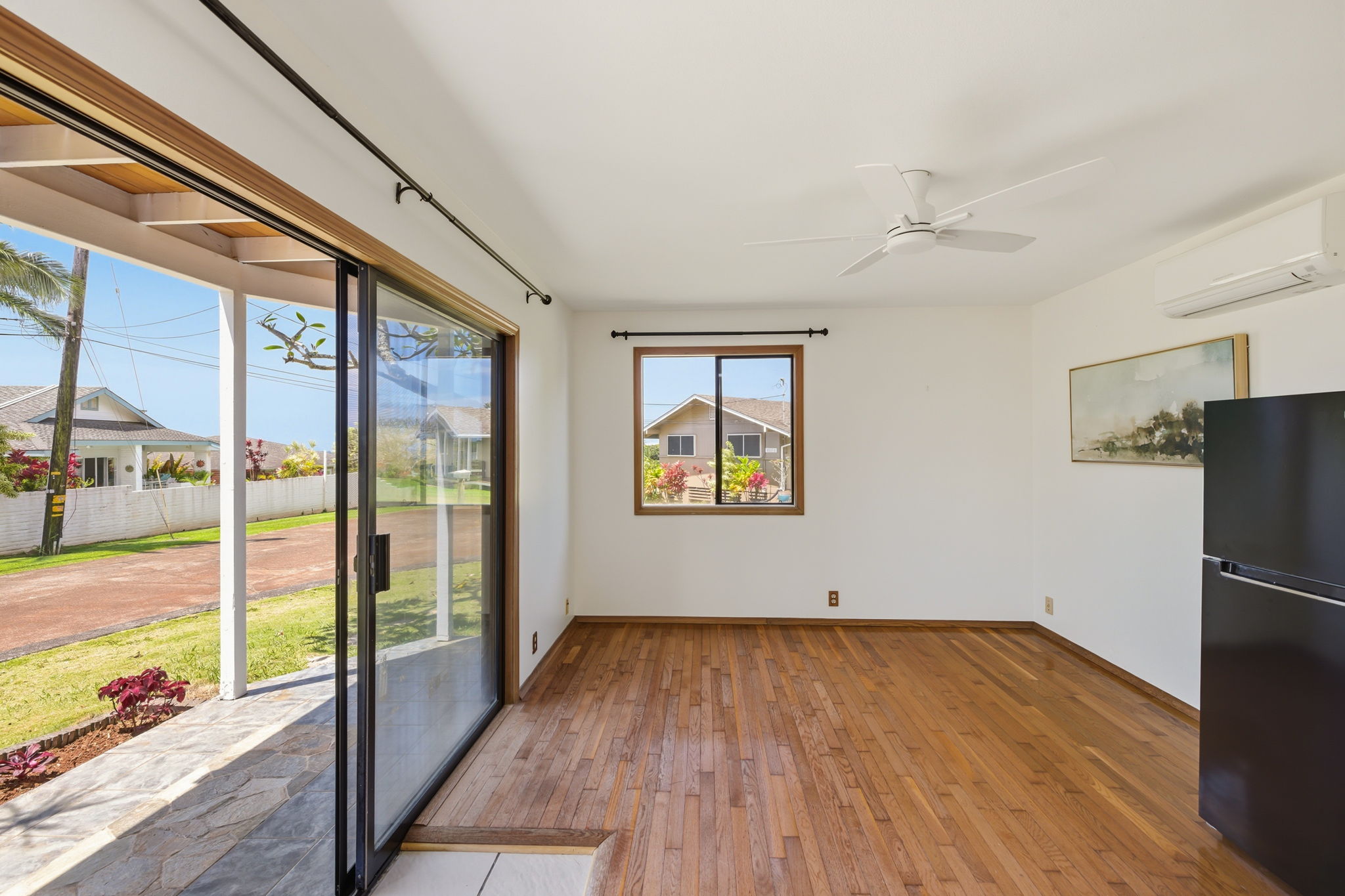 3685 Waha Road Kalaheo, HI 96741 - Photo 18 of 30 a view of empty room with wooden floor and fan