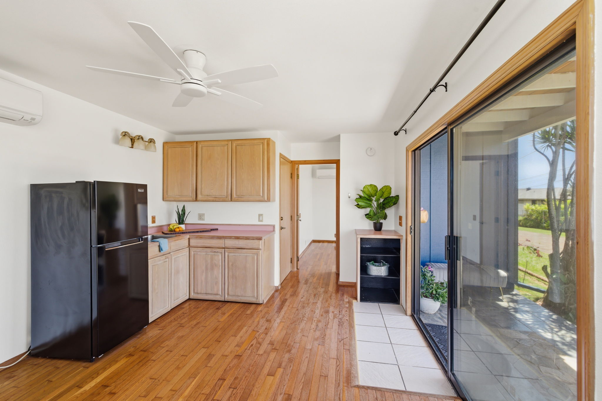 3685 Waha Road Kalaheo, HI 96741 - Photo 20 of 30 a kitchen with a refrigerator and a stove