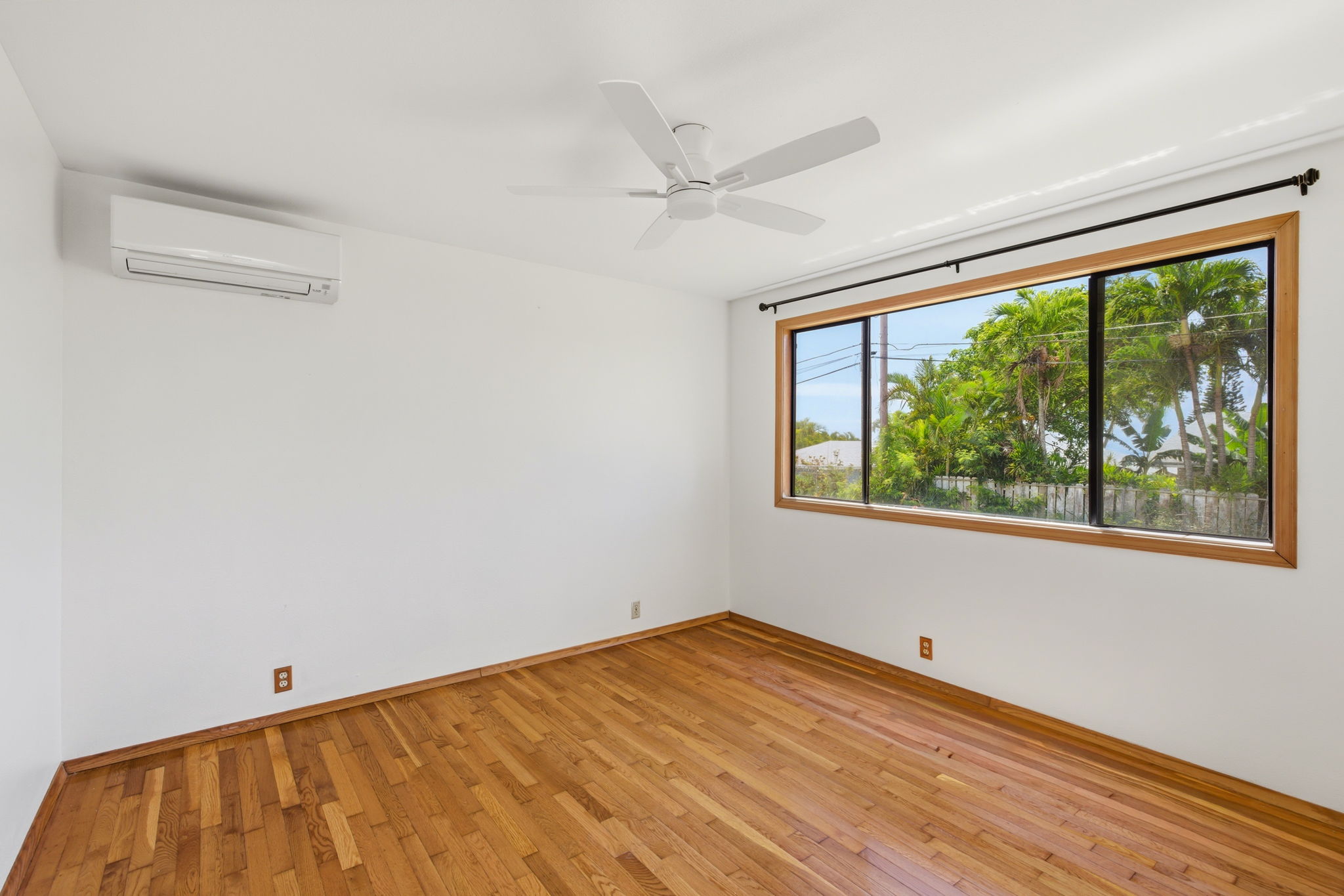 3685 Waha Road Kalaheo, HI 96741 - Photo 21 of 30 a view of empty room with wooden floor and fan