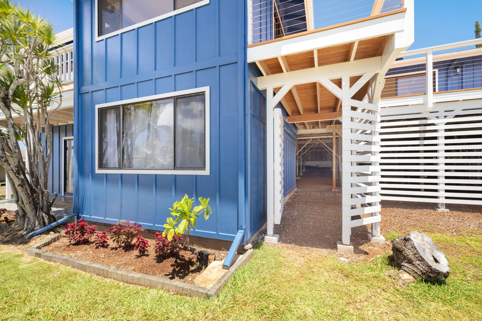 3685 Waha Road Kalaheo, HI 96741 - Photo 28 of 30 a view of a backyard with a chair and potted plants