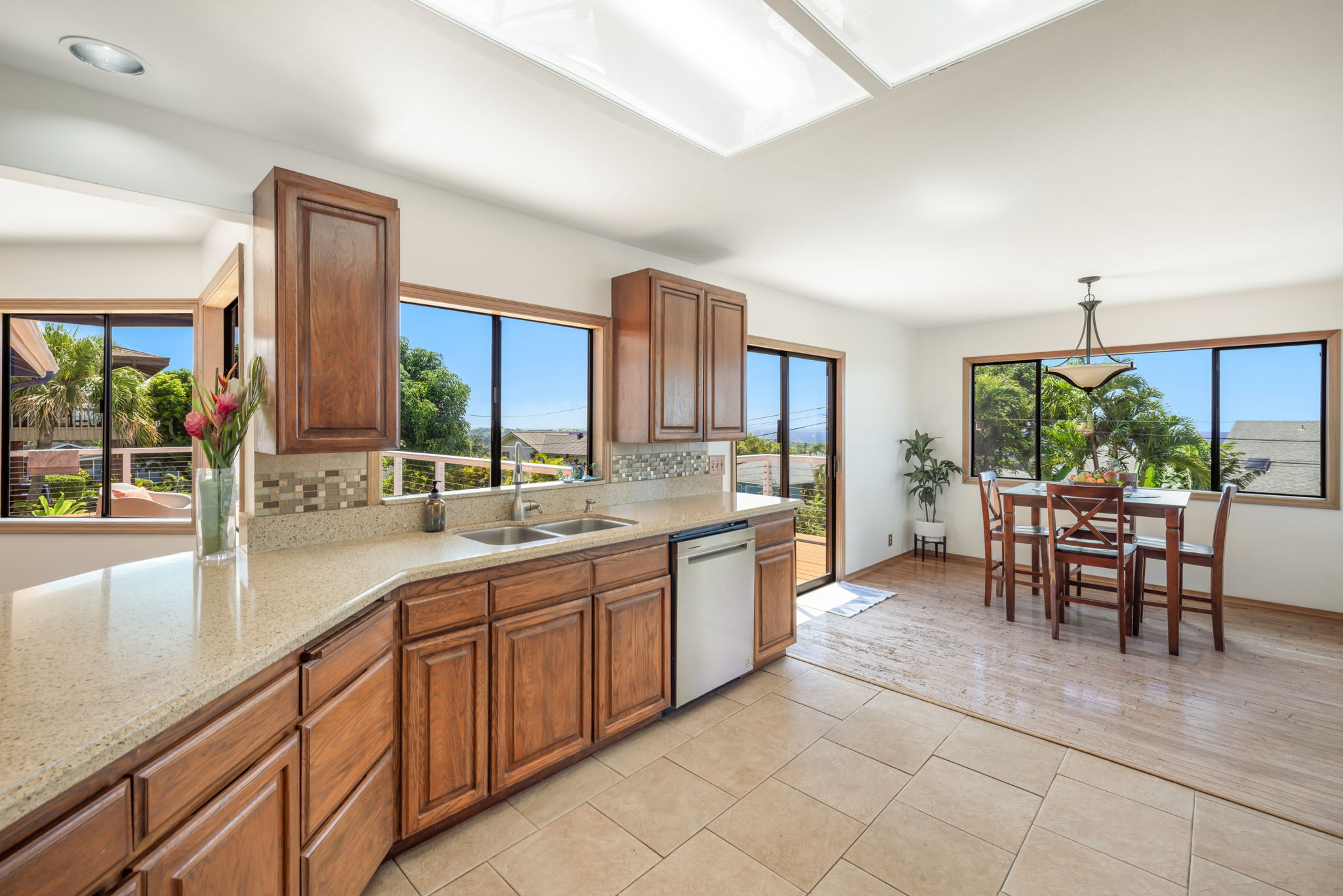 3685 Waha Road Kalaheo, HI 96741 - Photo 4 of 30 a open kitchen with stainless steel appliances granite countertop sink and cabinets