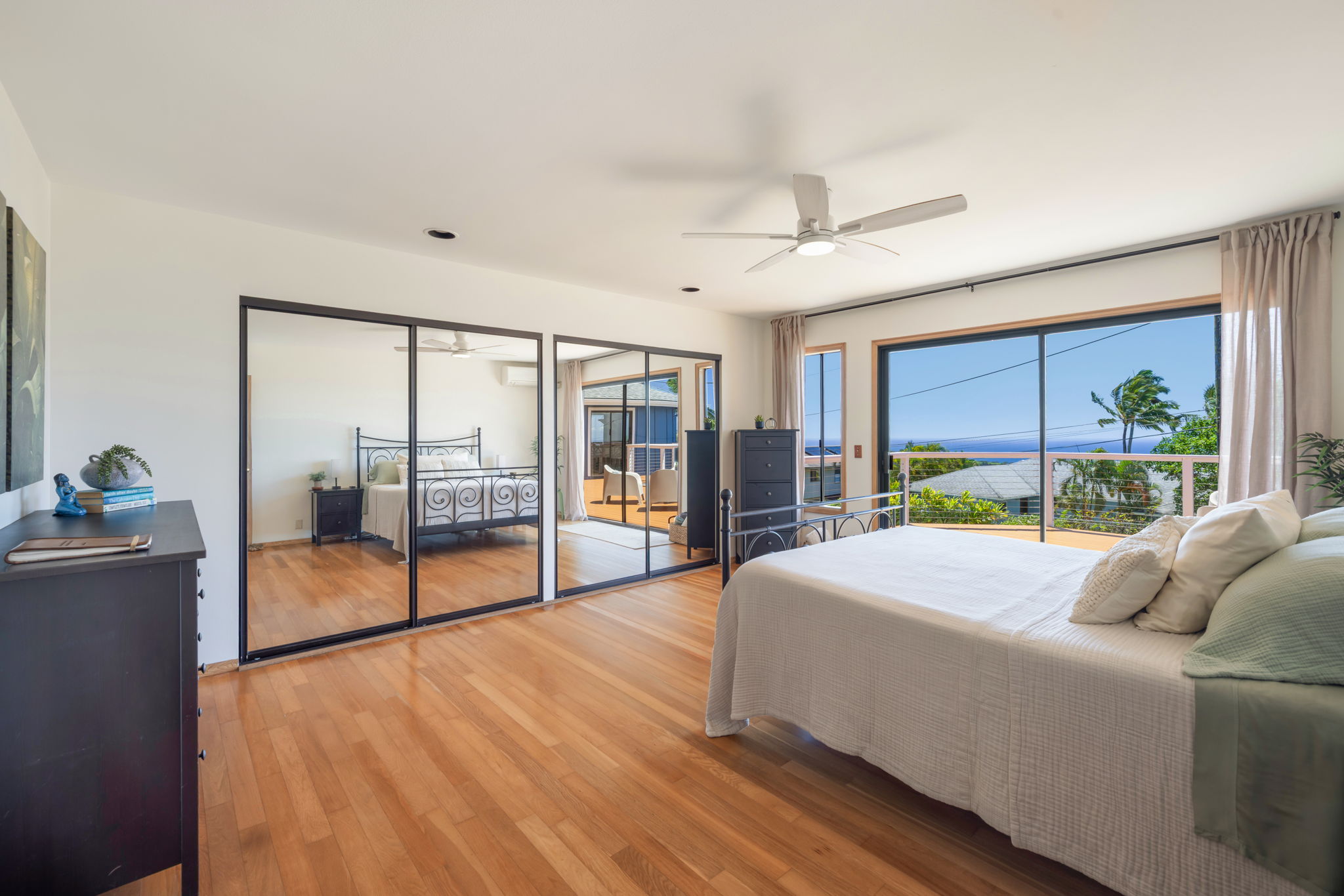 3685 Waha Road Kalaheo, HI 96741 - Photo 9 of 30 a bed room with a bed and a large window