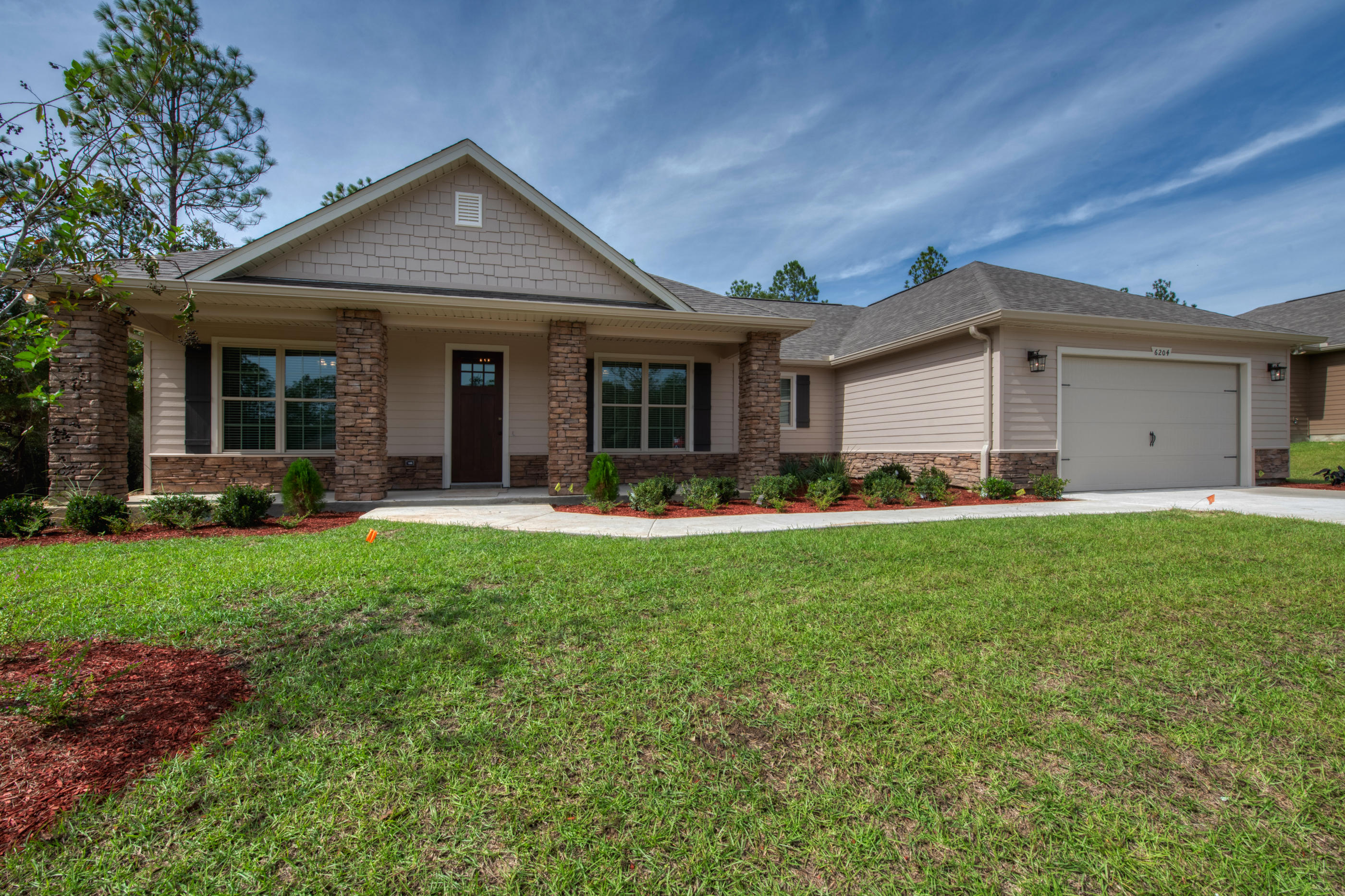 6195 Timberland Ridge Drive Crestview, FL 32539 - Photo 1 of 39 a front view of house with yard and green space