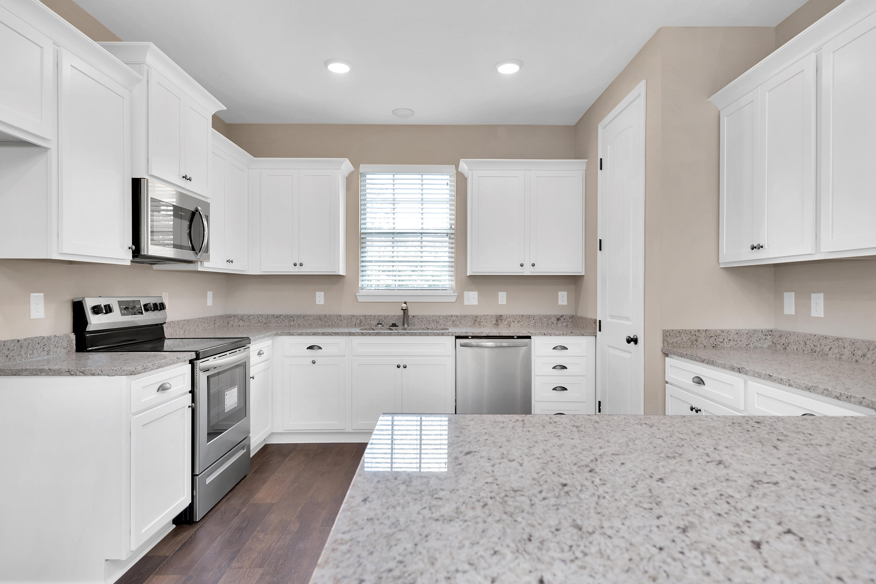 6195 Timberland Ridge Drive Crestview, FL 32539 - Photo 13 of 39 a kitchen with stainless steel appliances granite countertop a stove sink and cabinets