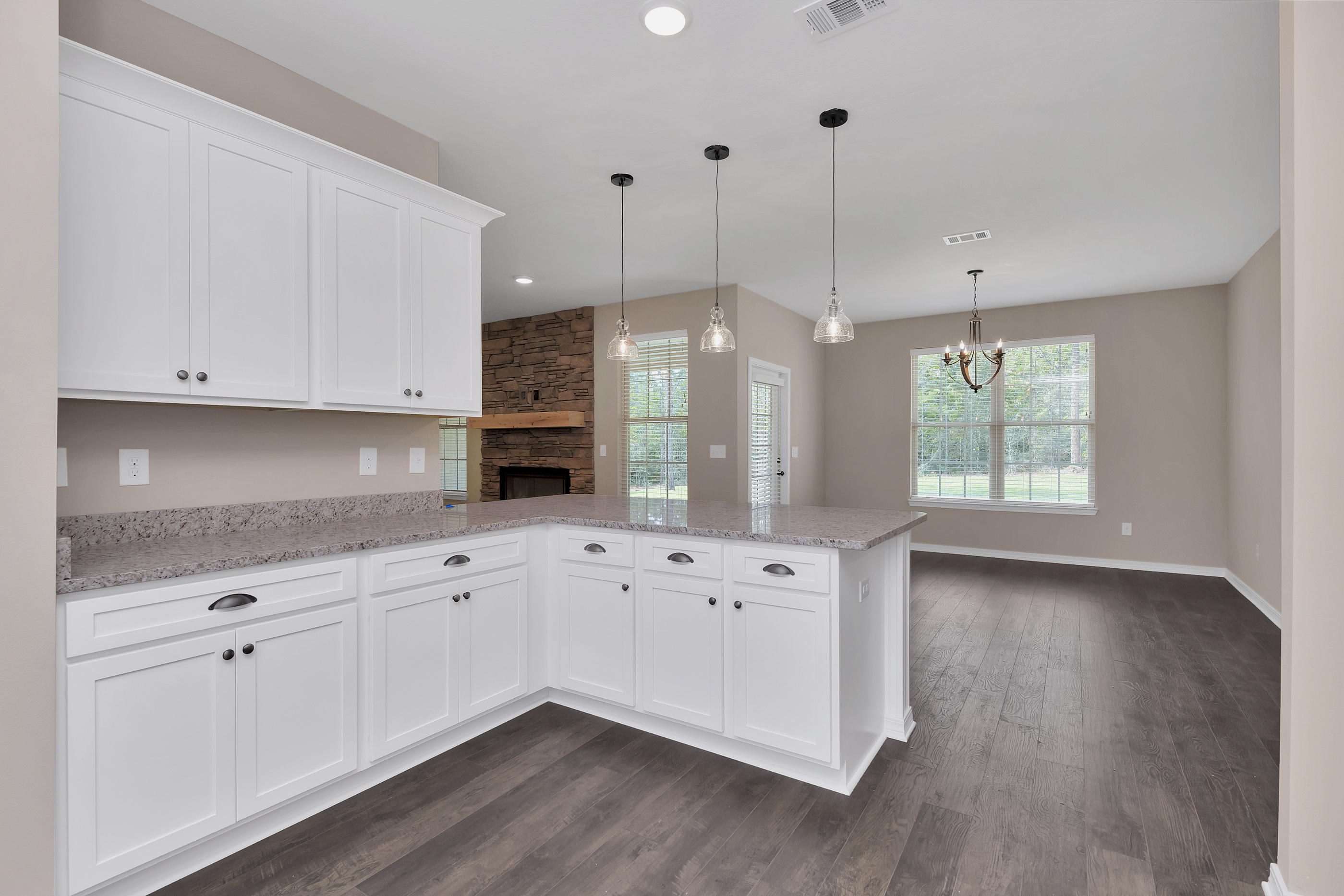 6195 Timberland Ridge Drive Crestview, FL 32539 - Photo 18 of 39 a kitchen with granite countertop white cabinets white stainless steel appliances with wooden floor and cabinets