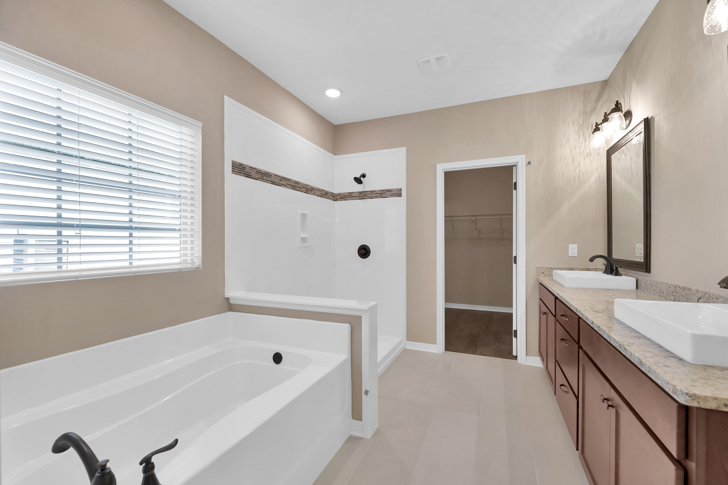 6195 Timberland Ridge Drive Crestview, FL 32539 - Photo 25 of 39 a bathroom with a tub sink and mirror